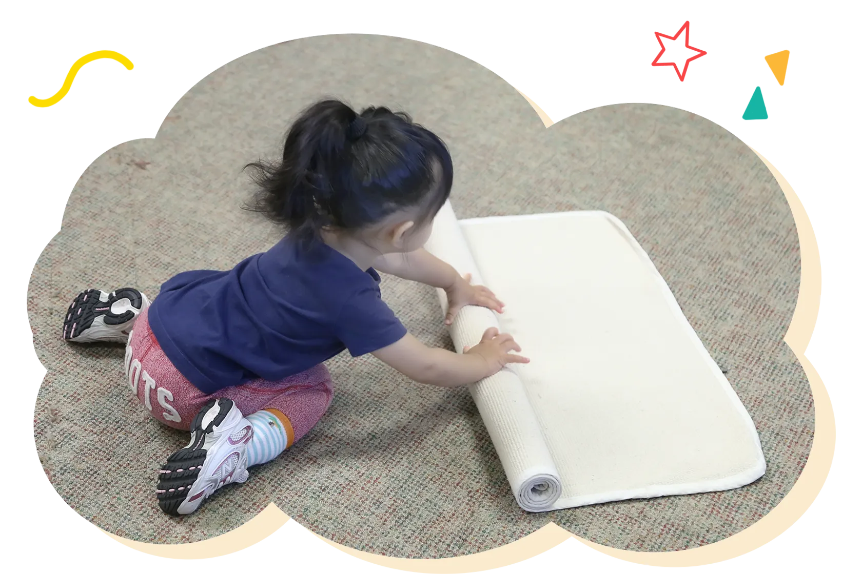 Toddler exploring Montessori materials in the classroom